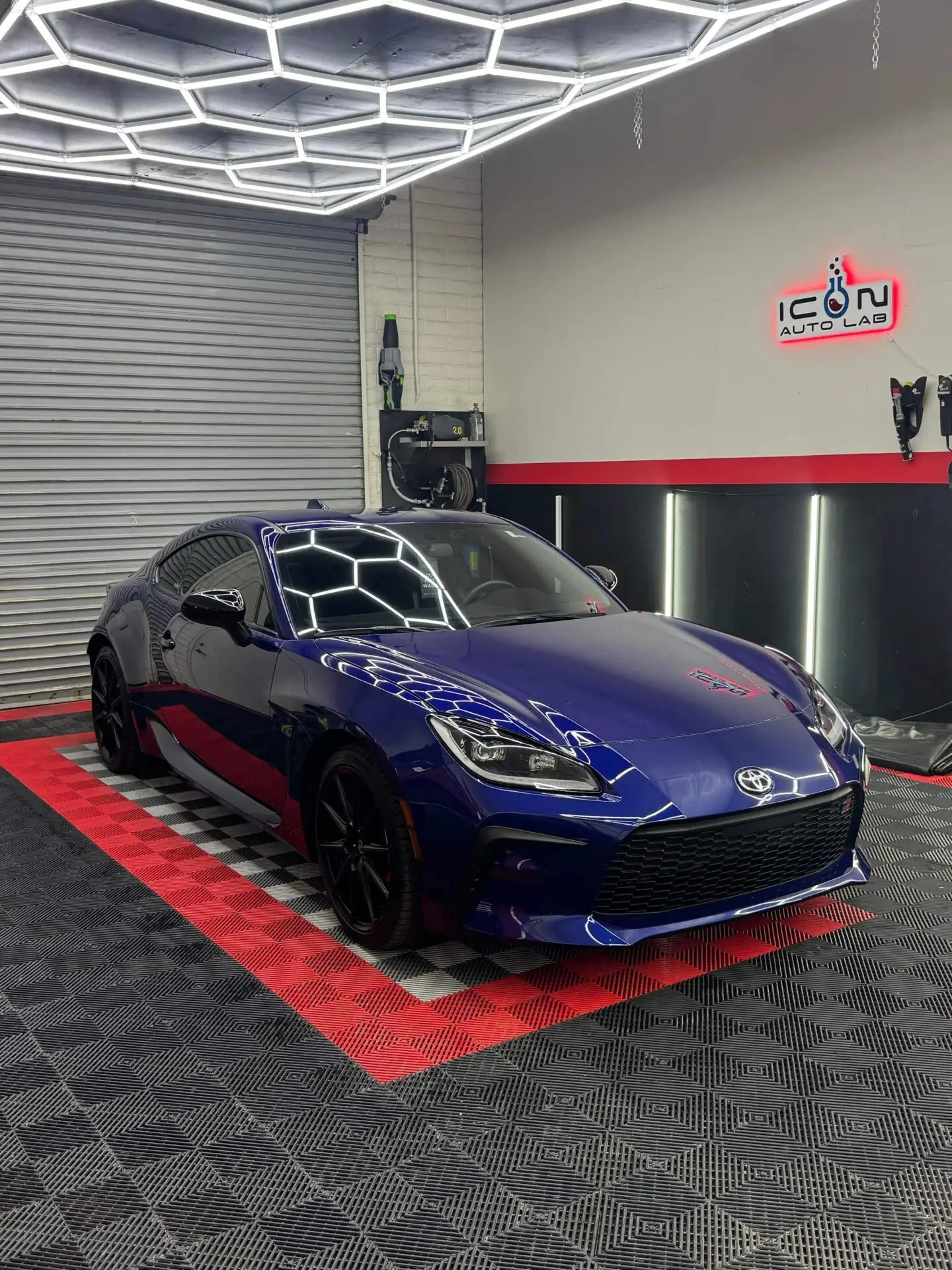 Blue sports car in ICON Auto Lab showroom