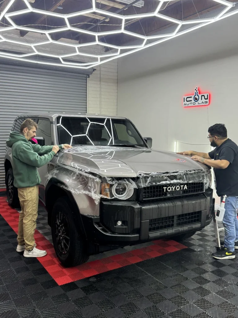 ICON Auto Lab — protective film being fitted to the front of a Toyota SUV