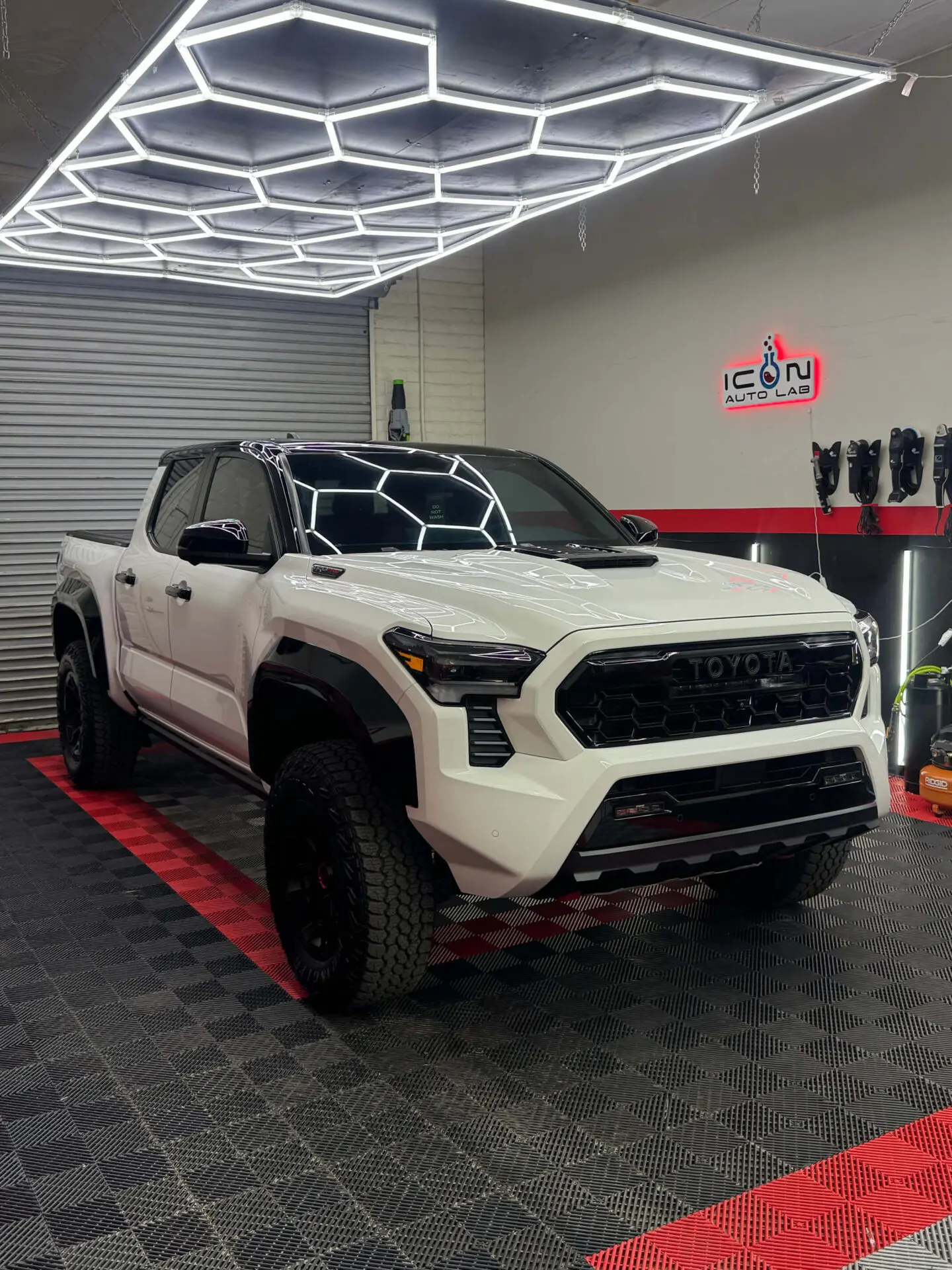 ICON Auto Lab — customer truck in the branded Tucson workshop