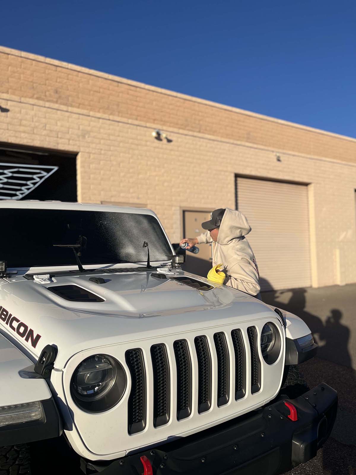 ICON Auto Lab — technician detailing a Jeep