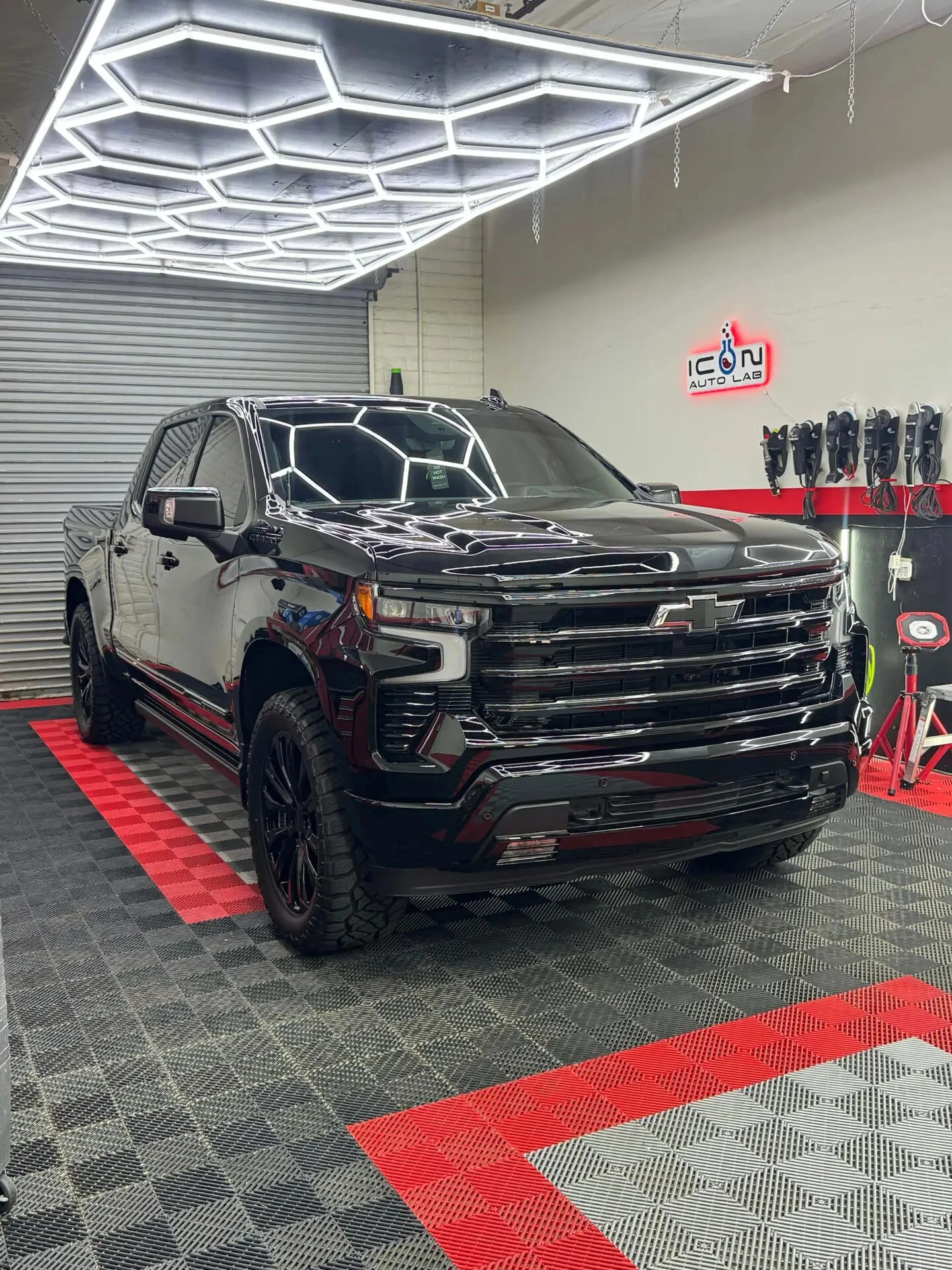 Black GMC vehicle with tinted windows